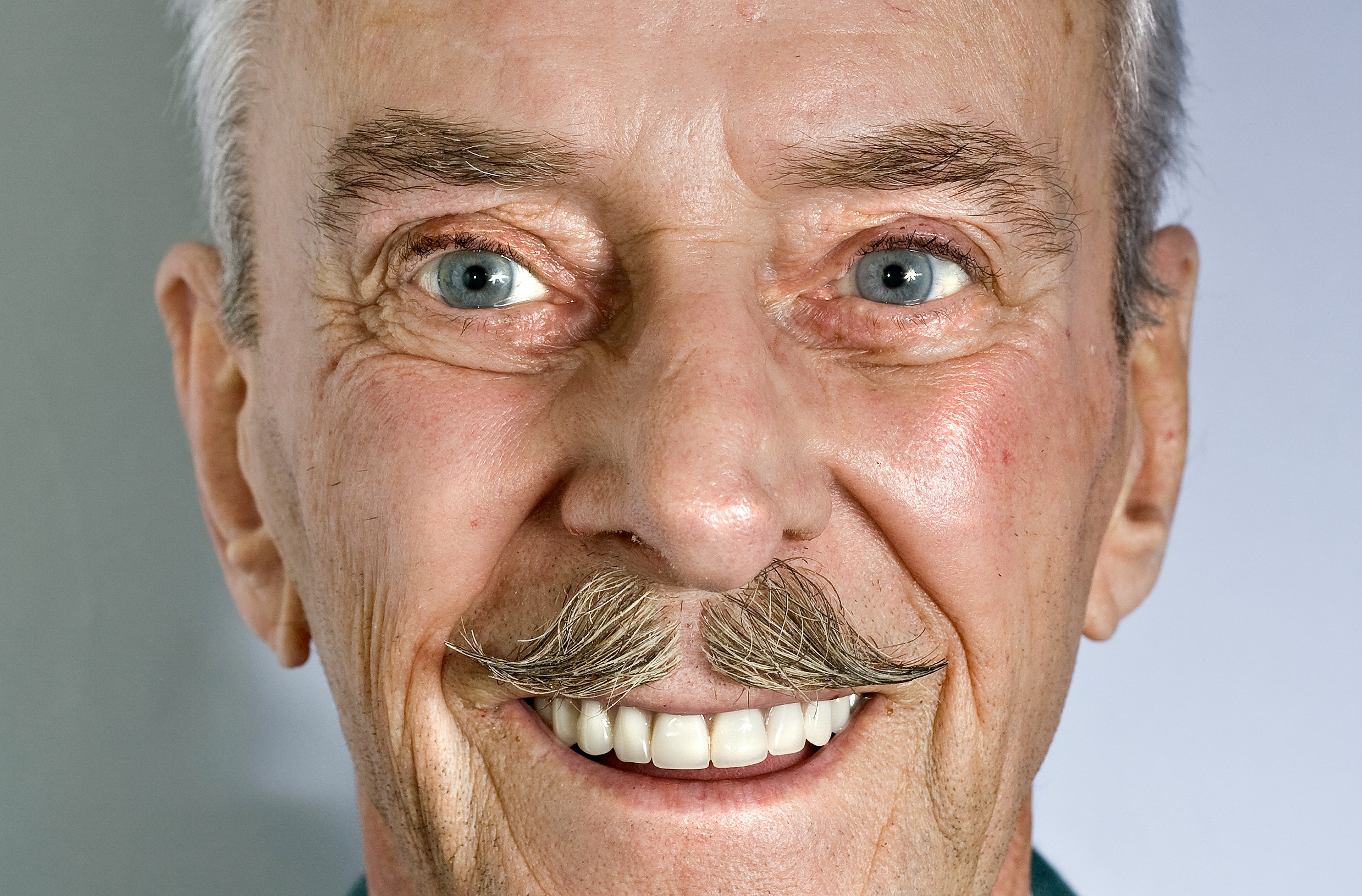 Patient with healthy, natural-looking dental bridge in Spokane